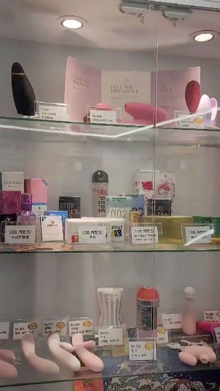 SHYMAN Sangbong adult goods store glass display case with Womanizer, suction vibes and TENGA on show